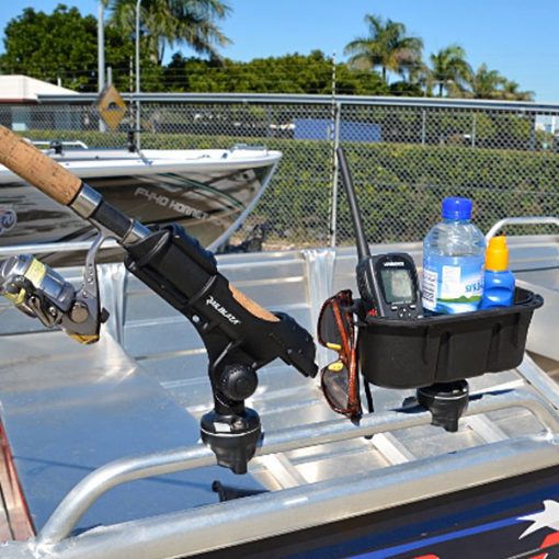 Railblaza Rail Mounted Starport used to mount a fishing rod holder and a storage caddy to the grab rail on an aluminium fishing boat