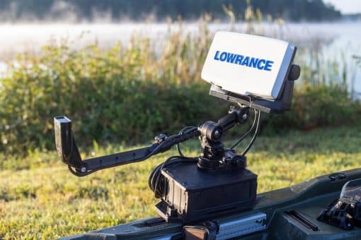 A Lowrance fish finder mounted to a fishing kayak using a YakAttack CellBlok battery box in combination with YakAttack's SwitchBlade transducer arm and a YakAttack fish finder mount