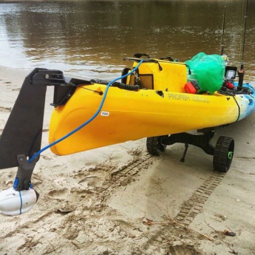 A kayak strapped to a Railblaza C-Tug Kayak & Canoe Cart with Kiwi Wheels for ytransport to the water