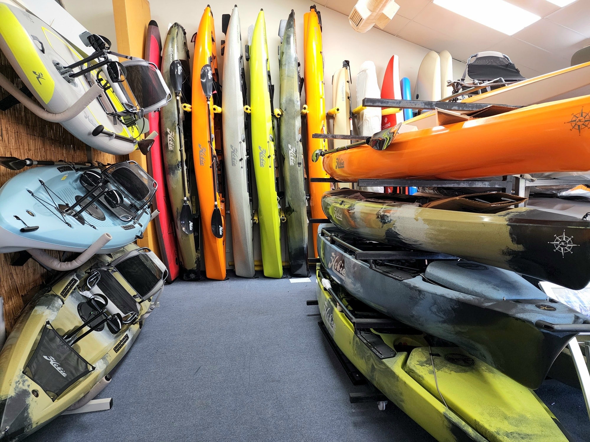 Racks of Hobie kayaks at the Hunter Water Sports showroom