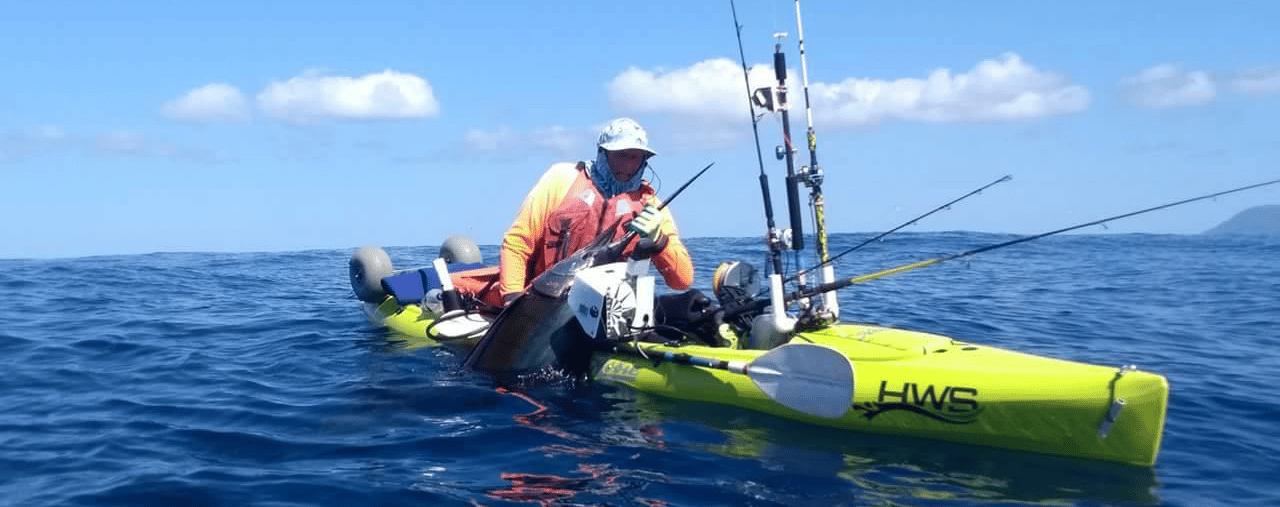 Hobie Revolution 13 fishing kayak open water with a sail fish