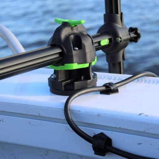 Close up image of the An angler using the Railblaza HEXX Live Pole 60 deck mount system