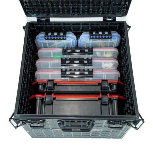 Seven tackle boxes of various sizes neatly organised in a YakAttack BlackPac kayak crate