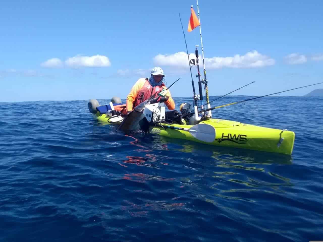 HWS customer Grant lands a sail fish aboard his Hobie Revolution 13 fishing kayak